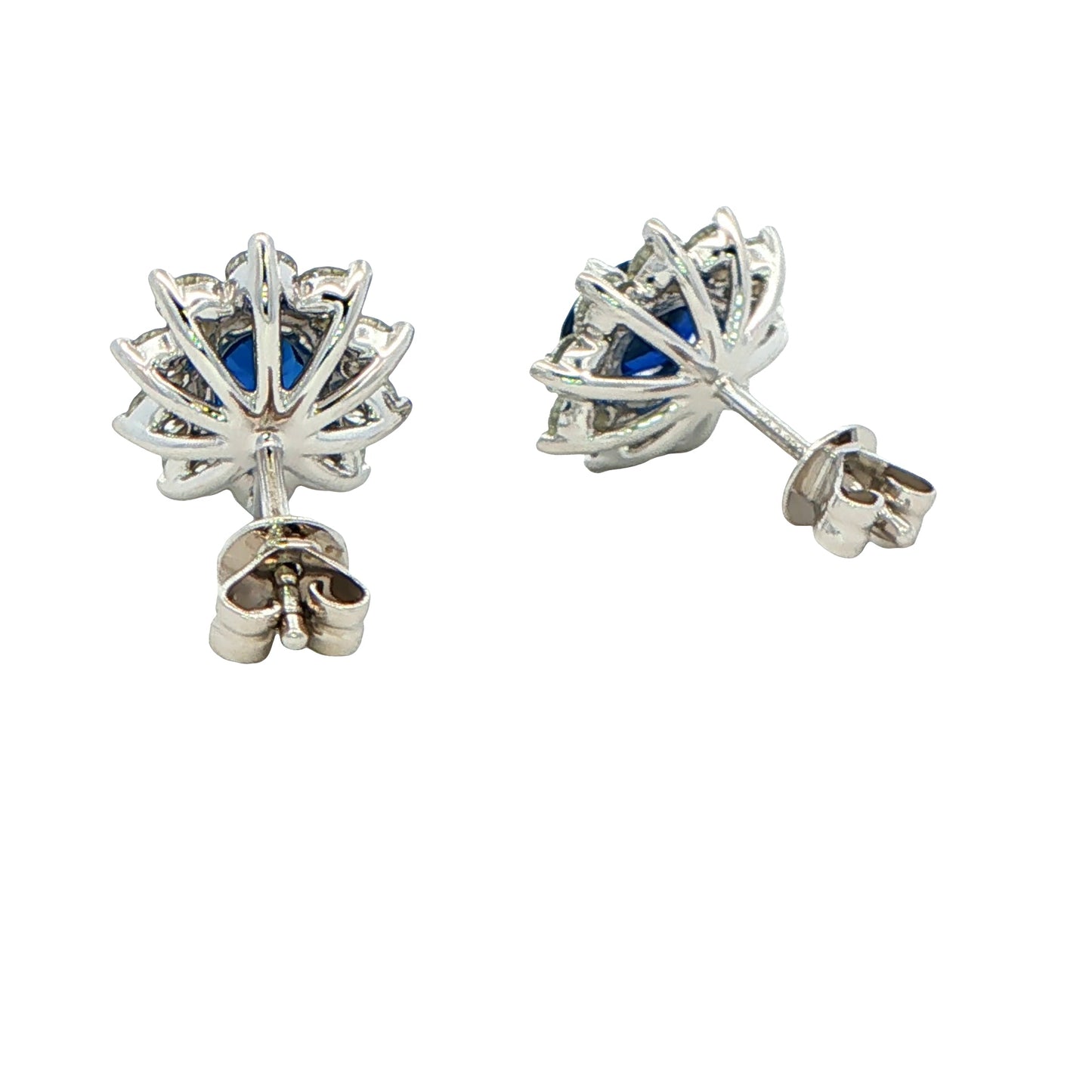 Oval shaped sapphire and round brilliant cut diamond cluster style earrings