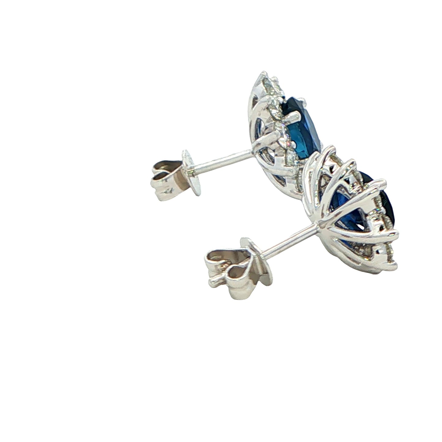 Oval shaped sapphire and round brilliant cut diamond cluster style earrings