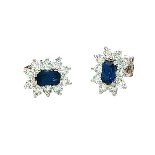 Octagonal shaped sapphire and round brilliant cut diamond cluster style earrings.