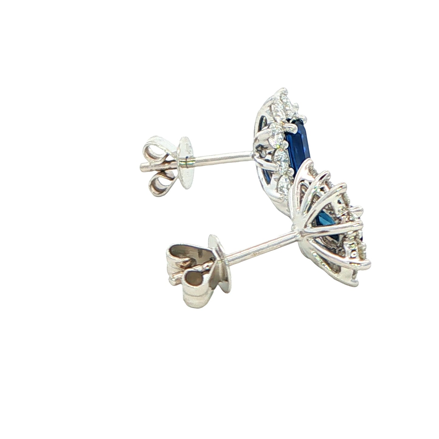 Octagonal shaped sapphire and round brilliant cut diamond cluster style earrings.