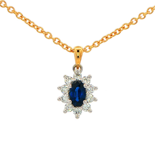Oval shaped sapphire and round brilliant cut diamond cluster style pendant