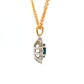 Oval shaped sapphire and round brilliant cut diamond cluster style pendant