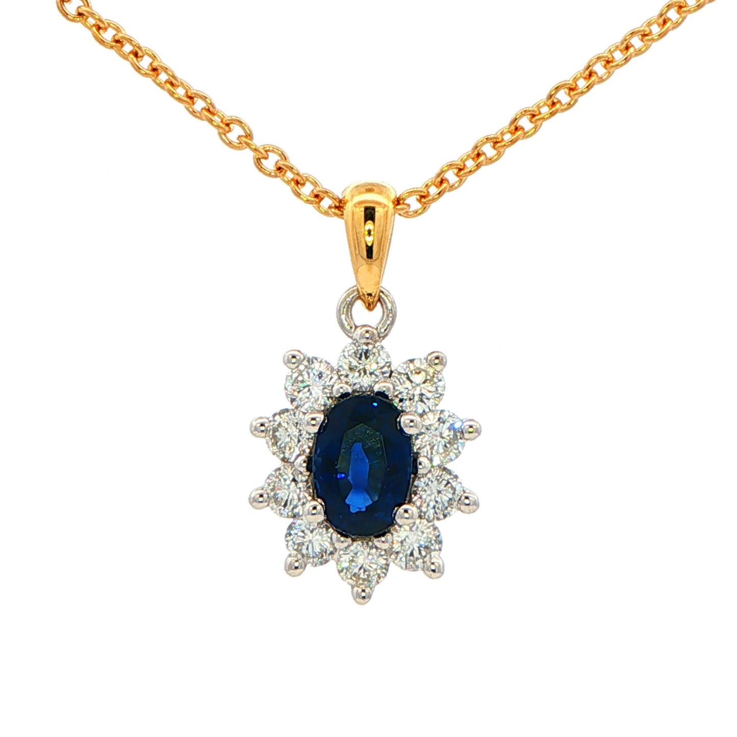 Oval shaped Sapphire and round brilliant cut diamond cluster style pendant