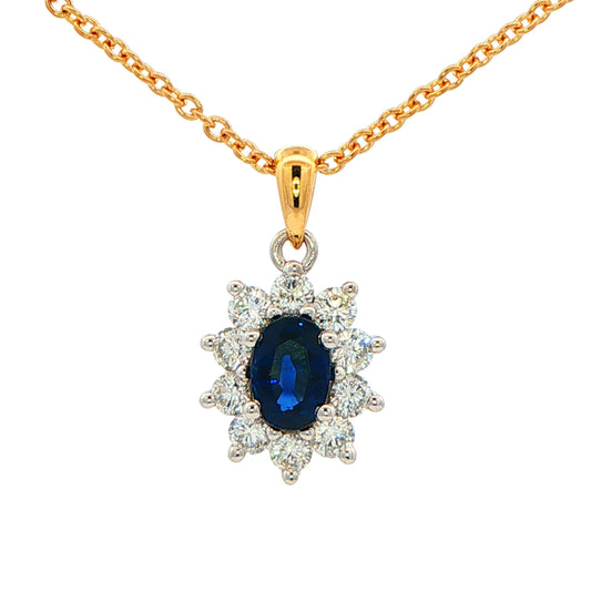 Oval shaped Sapphire and round brilliant cut diamond cluster style pendant