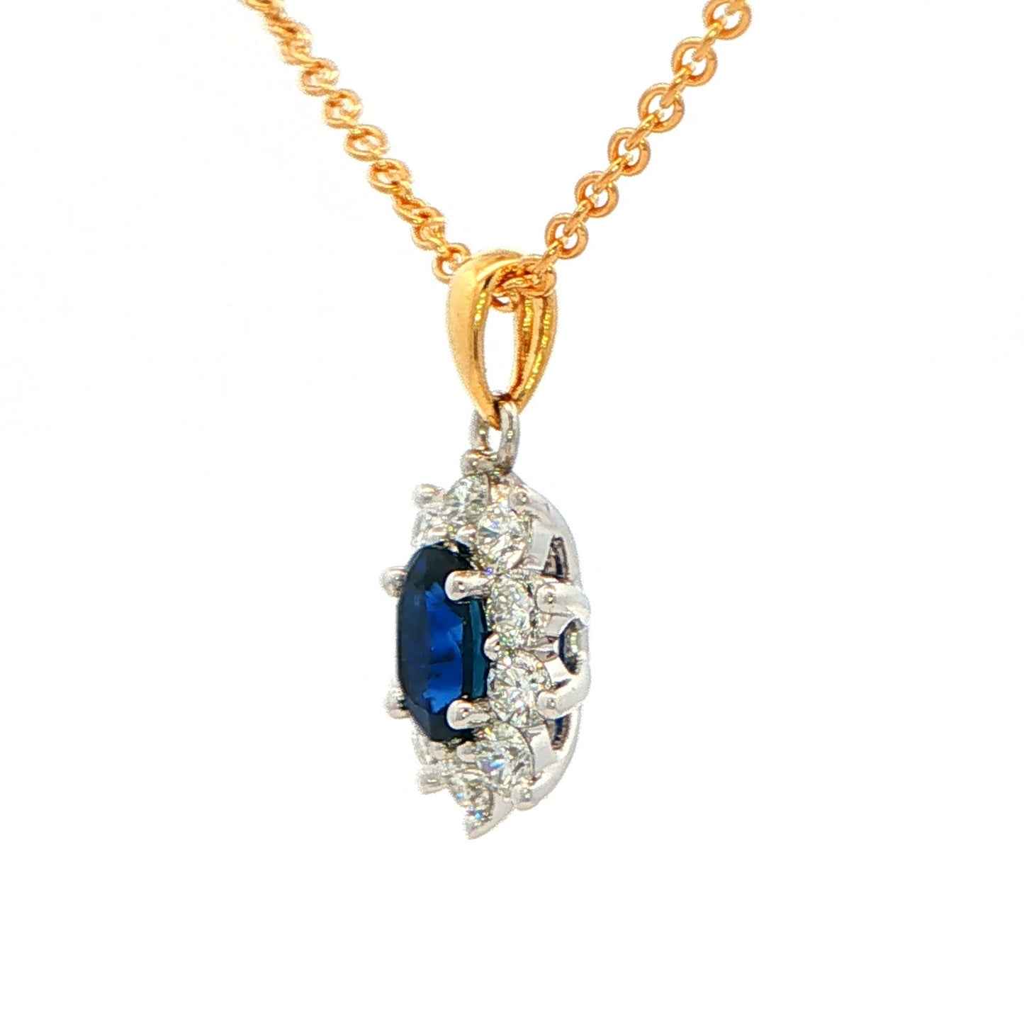 Oval shaped Sapphire and round brilliant cut diamond cluster style pendant