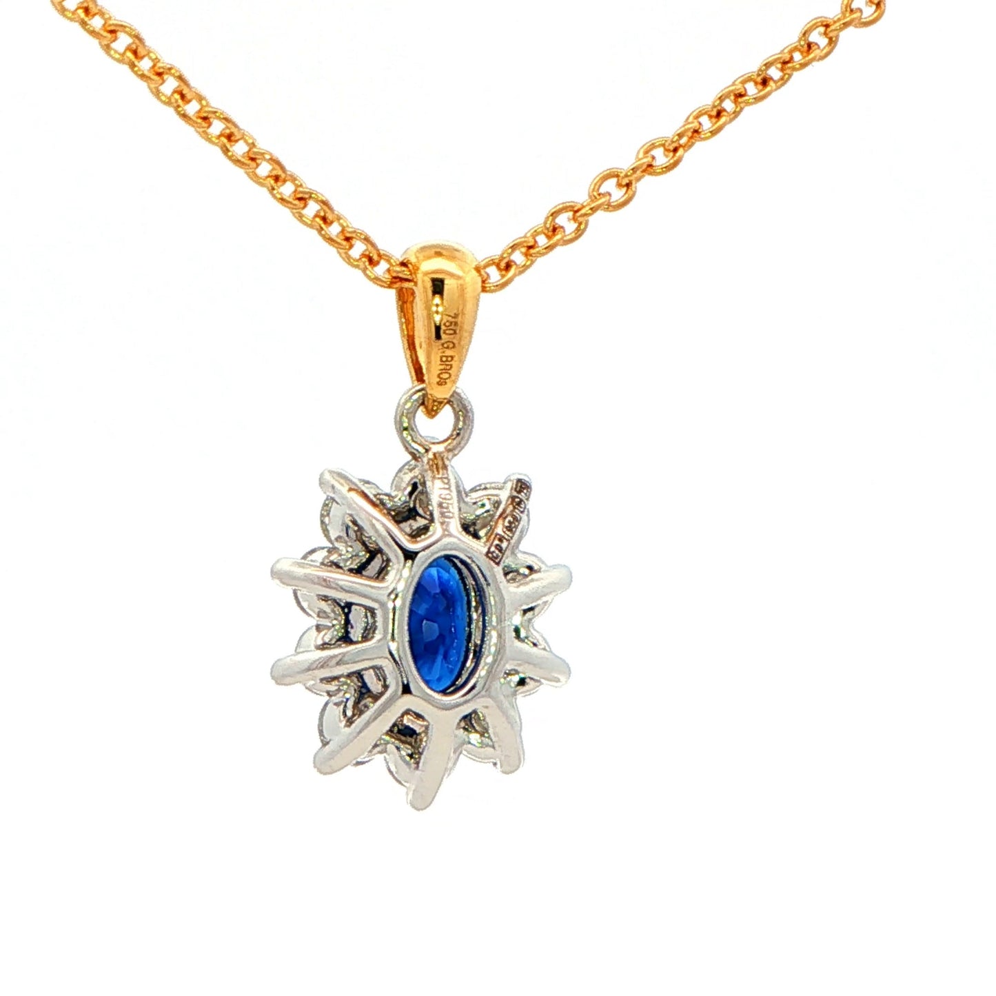 Oval shaped Sapphire and round brilliant cut diamond cluster style pendant