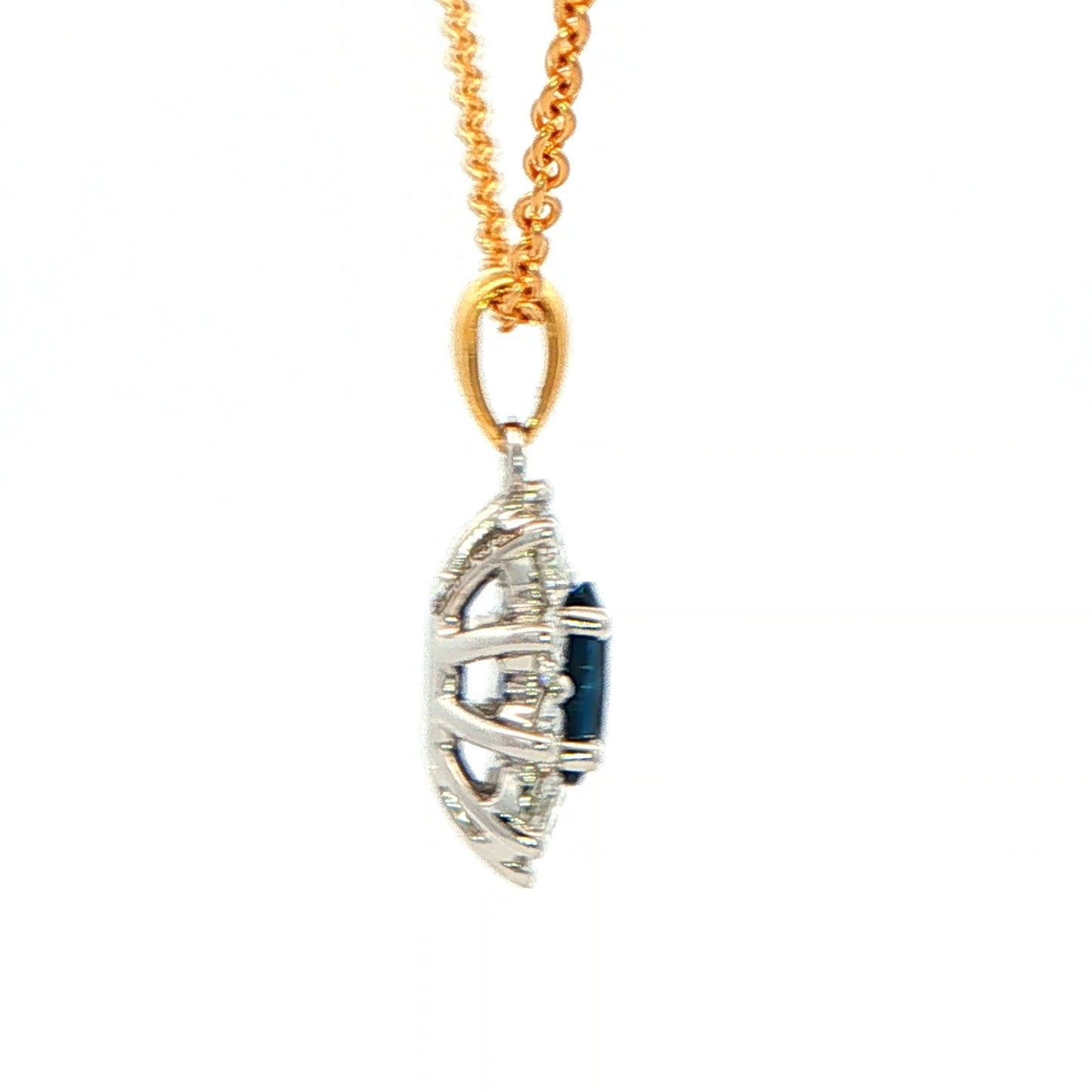 Oval shaped Sapphire and round brilliant cut diamond cluster style pendant