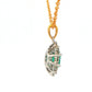 Oval shaped emerald and round brilliant cut diamond cluster style pendant