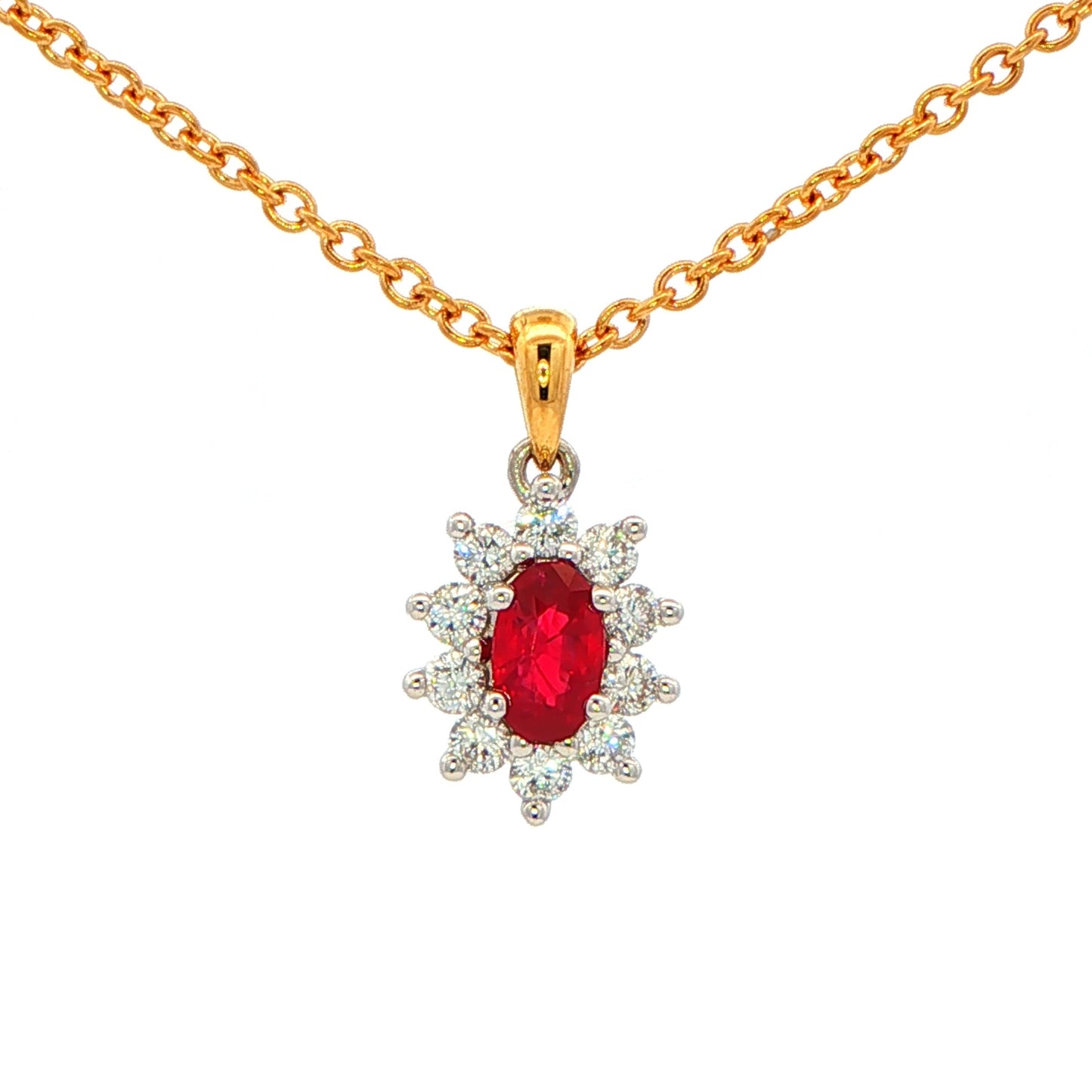 Oval shaped ruby and round brilliant cut diamond cluster style pendant