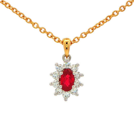 Oval shaped ruby and round brilliant cut diamond cluster style pendant