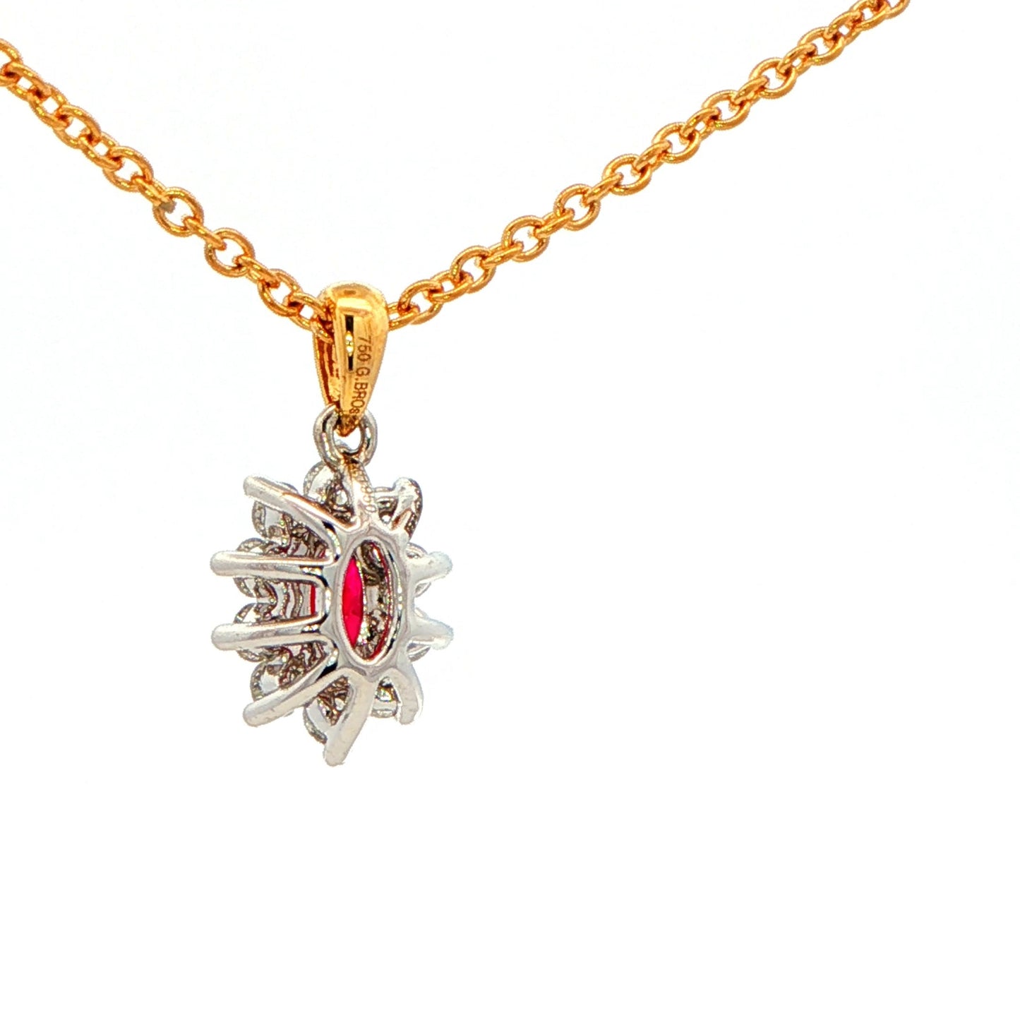 Oval shaped ruby and round brilliant cut diamond cluster style pendant