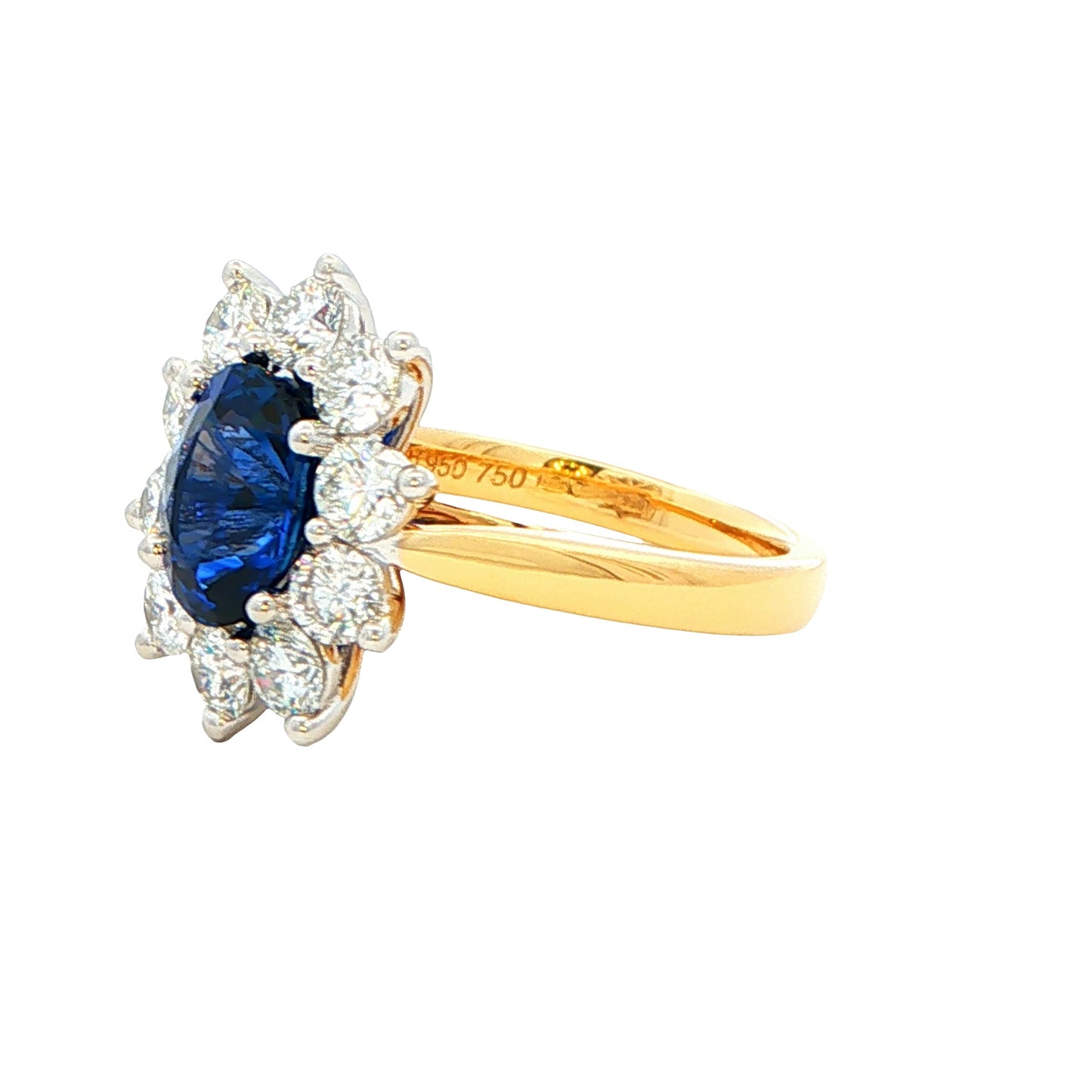 Oval Sapphire and round brilliant cut diamond cluster ring