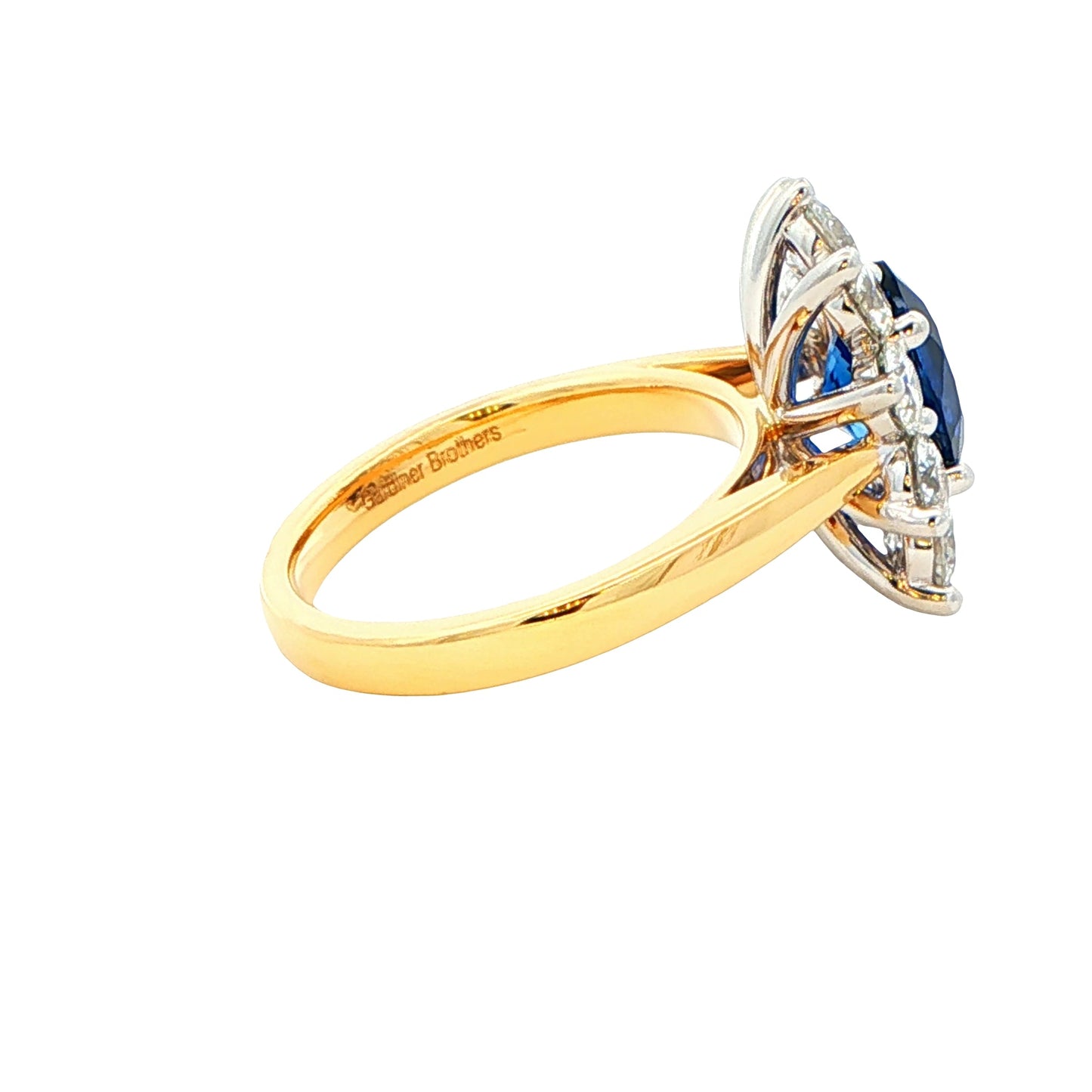 Oval Sapphire and round brilliant cut diamond cluster ring Gardiner Brothers