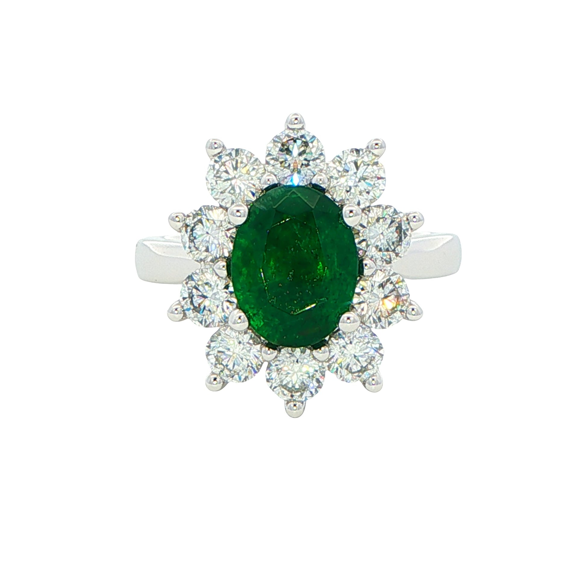 Oval shaped emerald and round brilliant cut diamond cluster style ring Gardiner Brothers