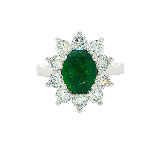 Oval shaped emerald and round brilliant cut diamond cluster style ring Gardiner Brothers