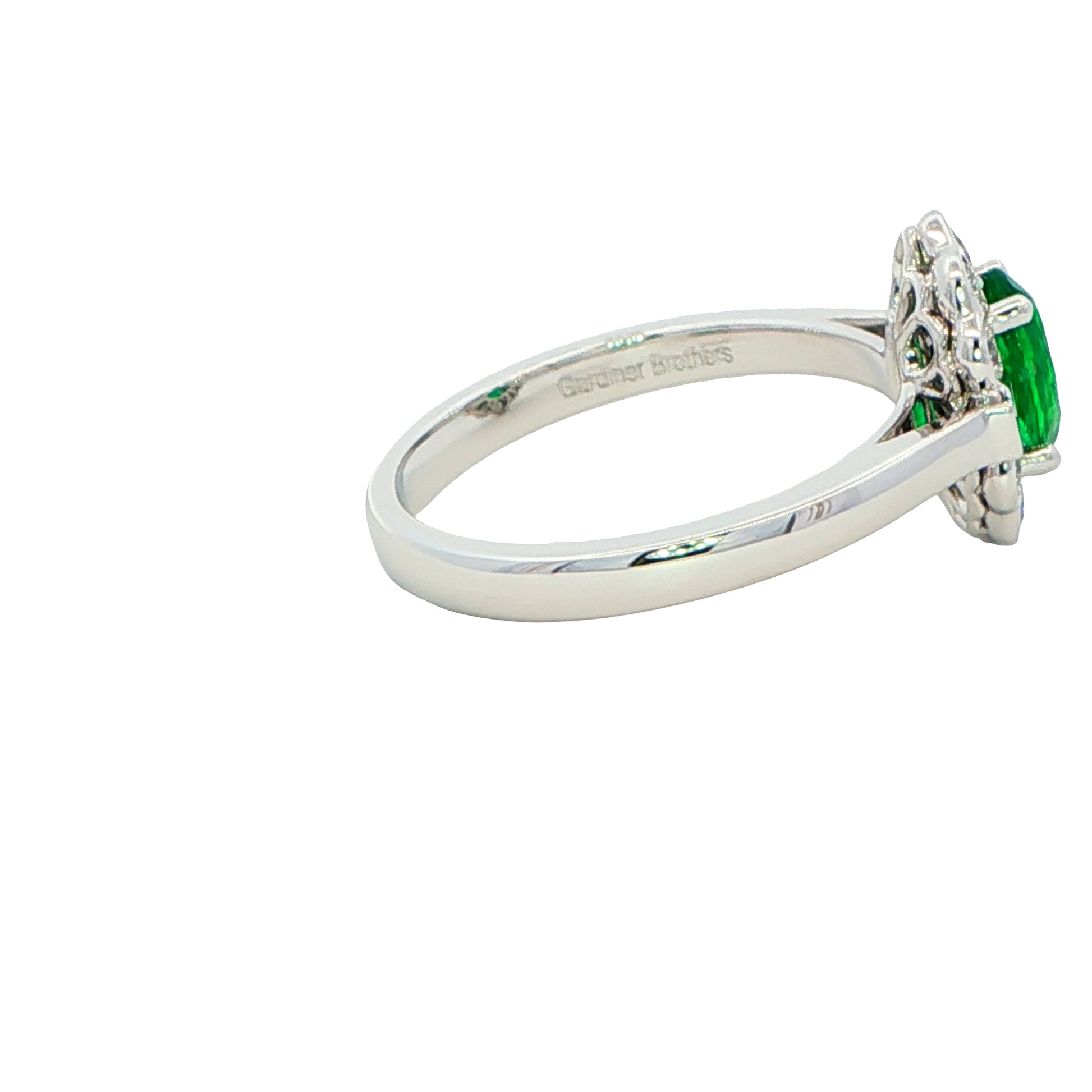 Oval emerald and diamond fancy cluster style ring Gardiner Brothers