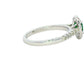 Emerald and round Brilliant Cut diamond halo style ring Gardiner Brothers