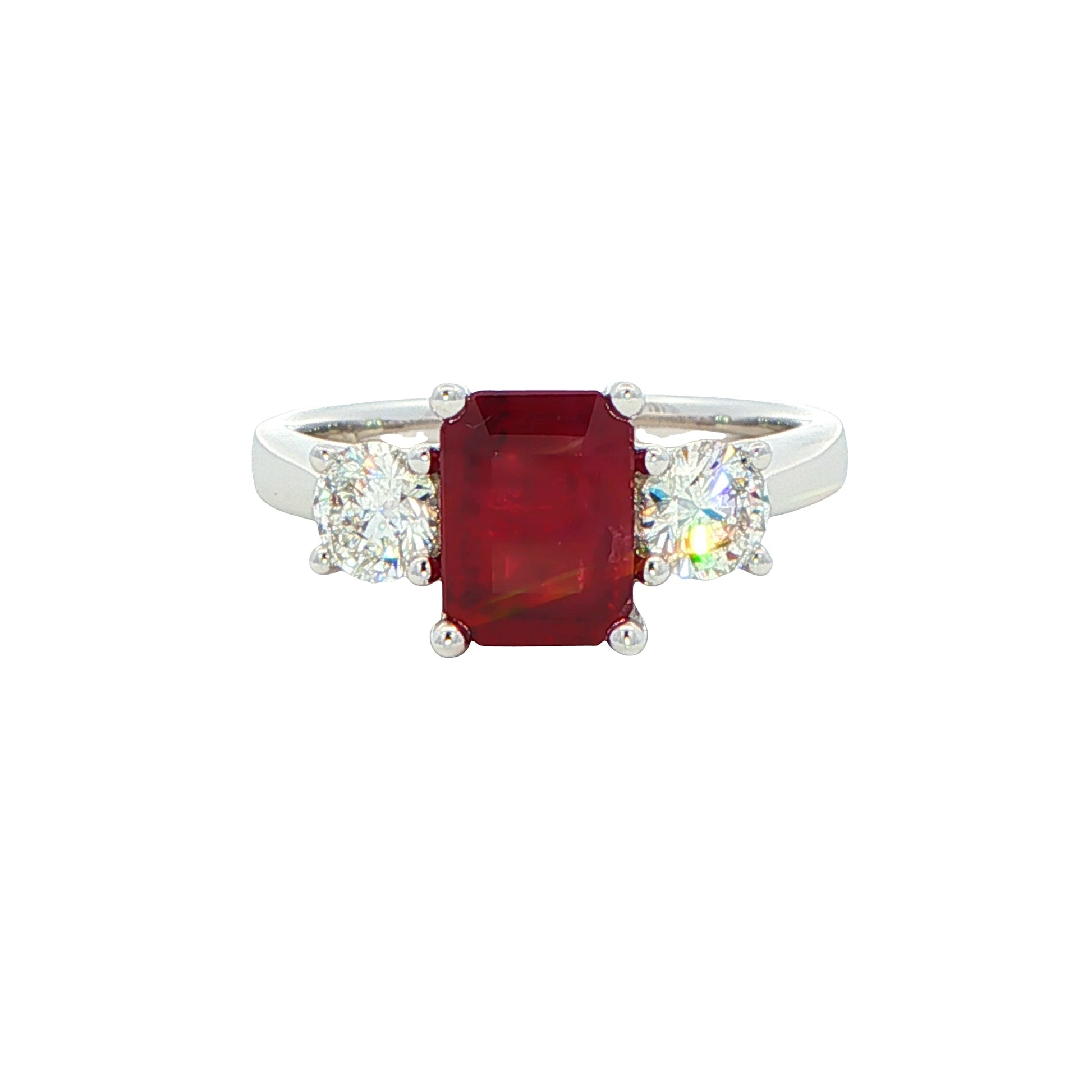 Octagonal shaped ruby with round brilliant cut diamond 3 stone ring Gardiner Brothers