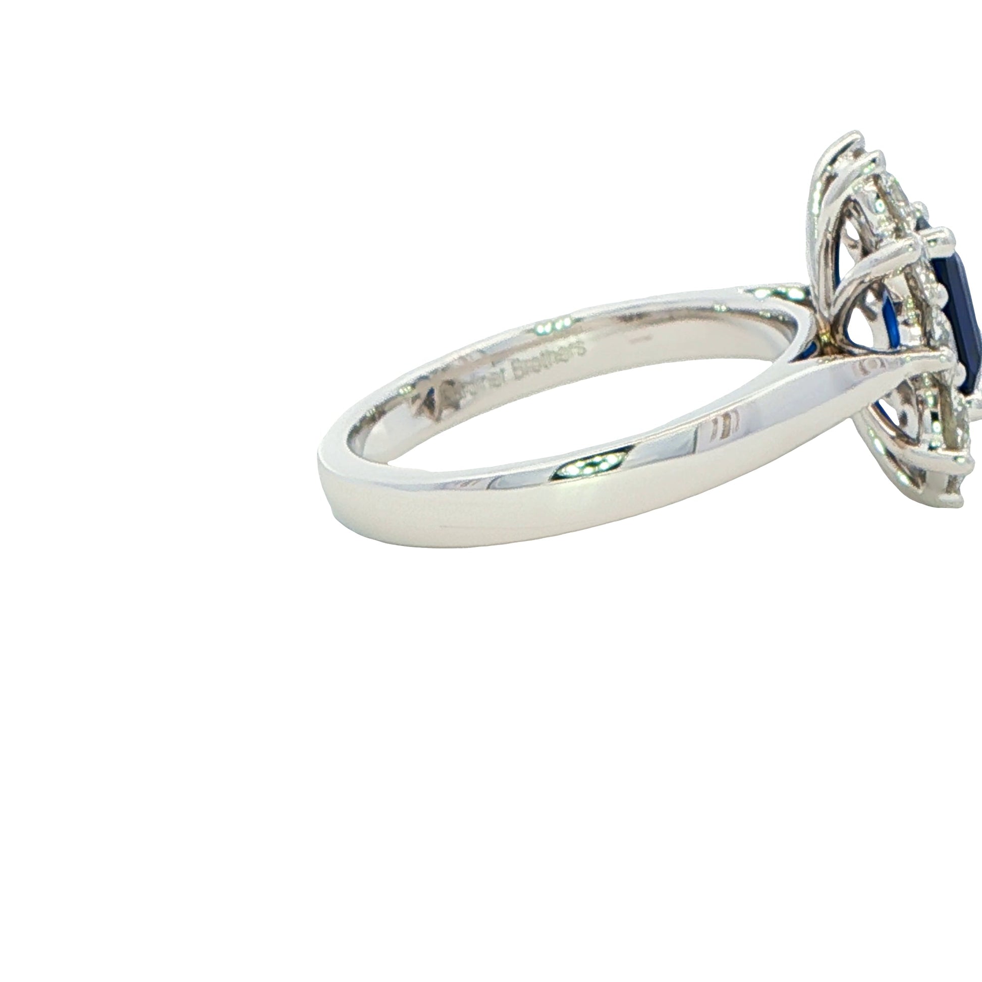 Octagonal Sapphire and round brilliant cut diamond cluster ring Gardiner Brothers