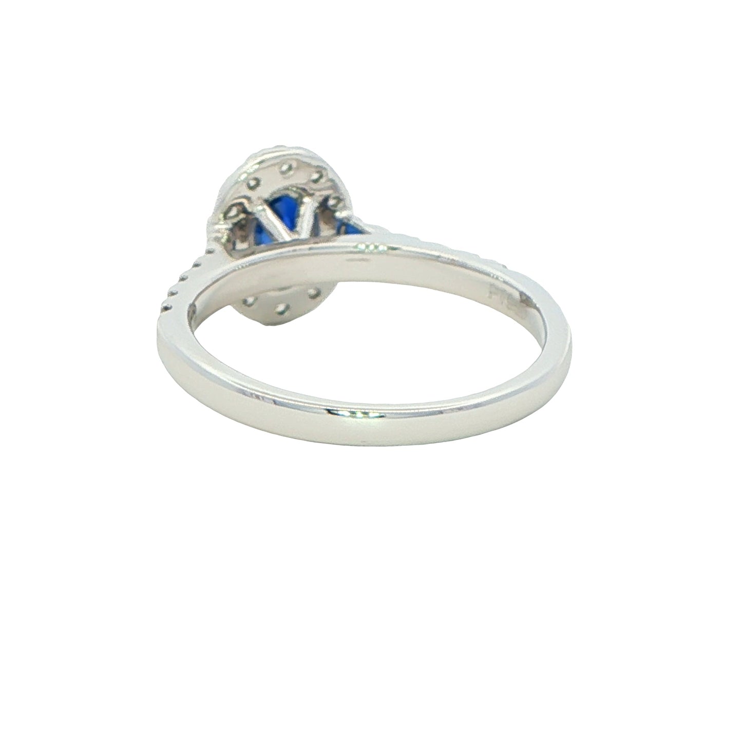 Oval shaped sapphire and round brilliant cut diamond halo style ring Gardiner Brothers