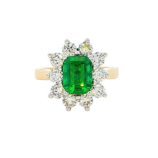 Octagonal shaped Emerald and round brilliant cut diamond cluster style ring Gardiner Brothers