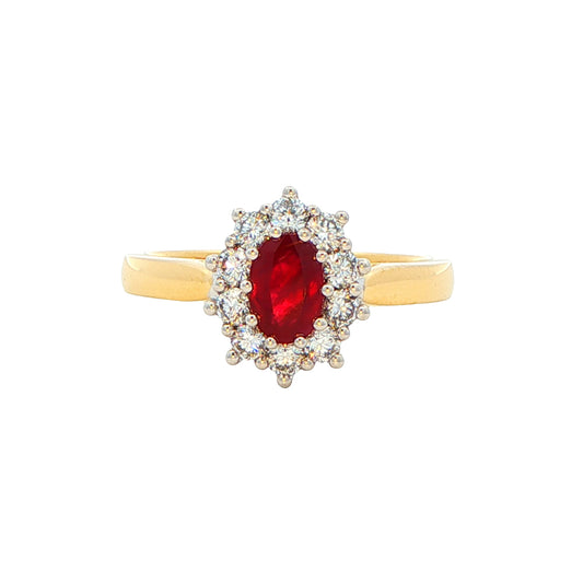 Oval Shaped Ruby and round brilliant cut diamond cluster style ring Gardiner Brothers