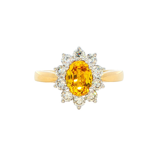 Oval Shaped Yellow Sapphire and round brilliant cut diamond cluster ring Gardiner Brothers