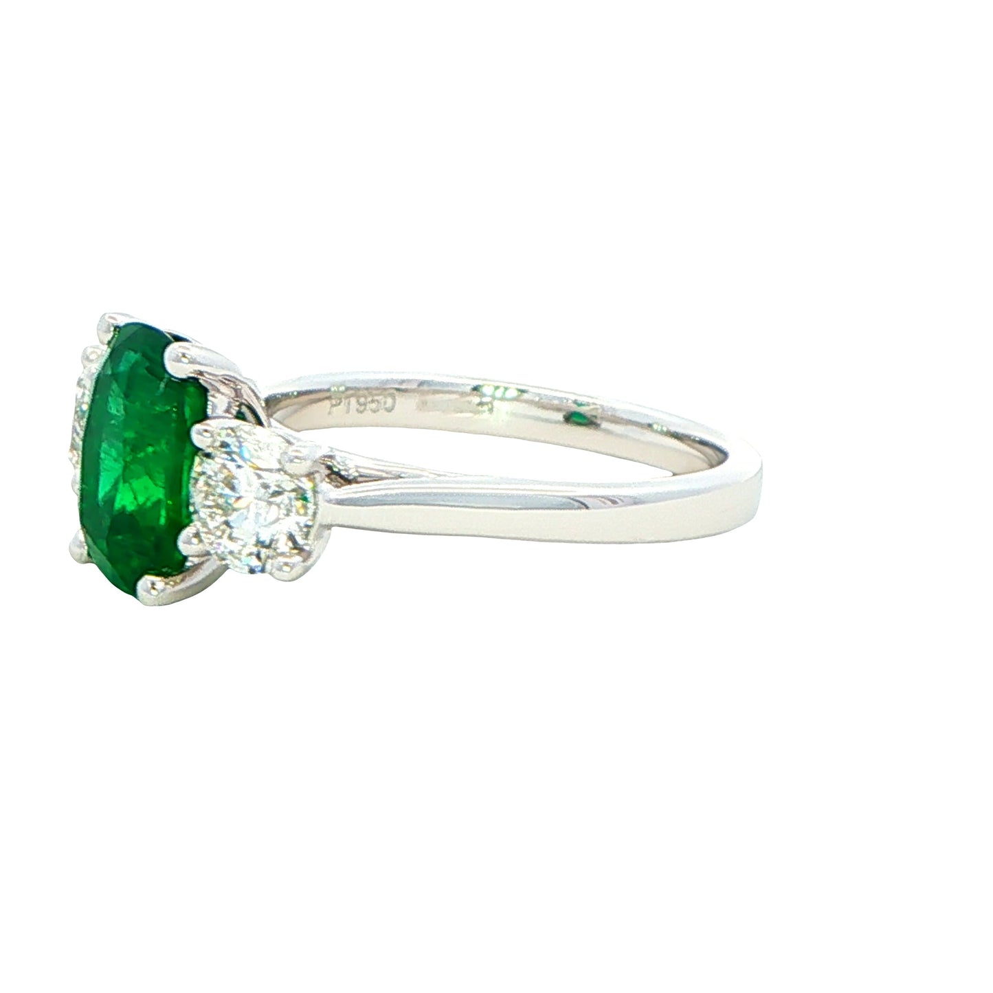 Cushion shaped emerald and round brilliant cut diamond 3 stone ring Gardiner Brothers