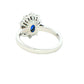 Oval shaped sapphire and round brilliant cut diamond cluster ring Gardiner Brothers