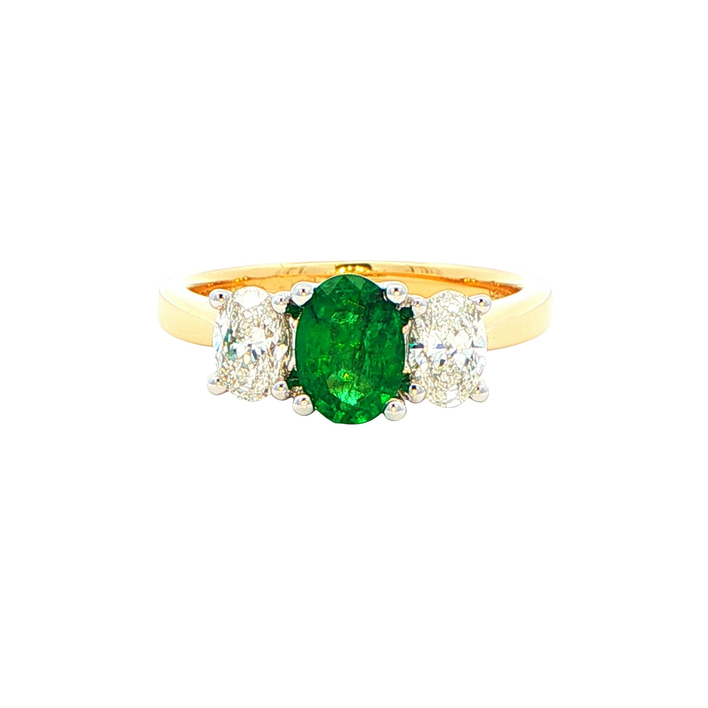 Oval shaped emerald and oval diamond 3 stone ring Gardiner Brothers