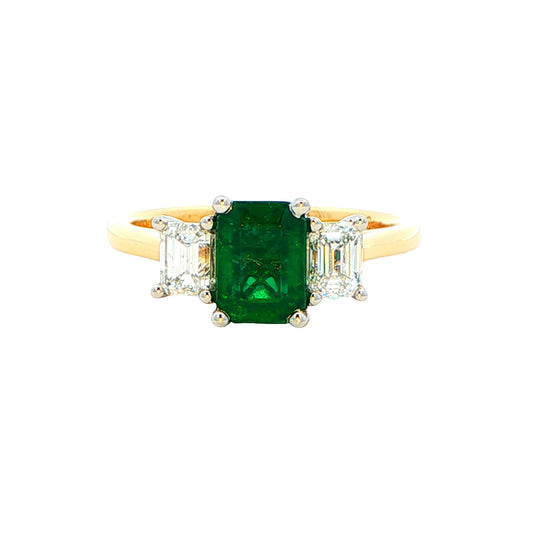 Octagonal shaped emerald and emerald cut diamond 3 stone ring Gardiner Brothers