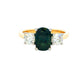 Cushion Shaped Teal Sapphire and round brilliant cut diamond 3 stone ring Gardiner Brothers