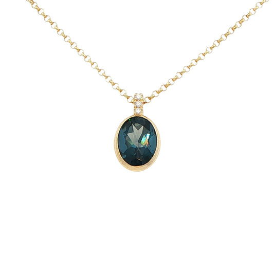Oval Shaped London Blue Topaz and round brilliant cut diamond pendant Gardiner Brothers