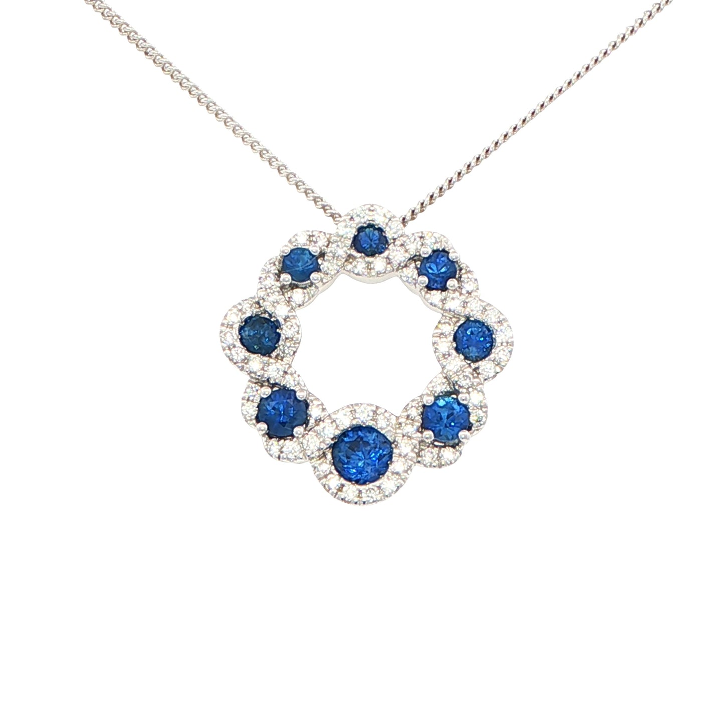 Sapphire and round brilliant cut diamond halo style circle pendant Gardiner Brothers