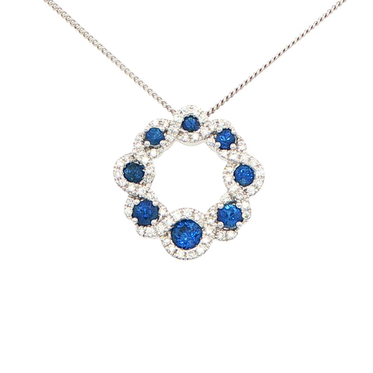 Sapphire and round brilliant cut diamond halo style circle pendant Gardiner Brothers