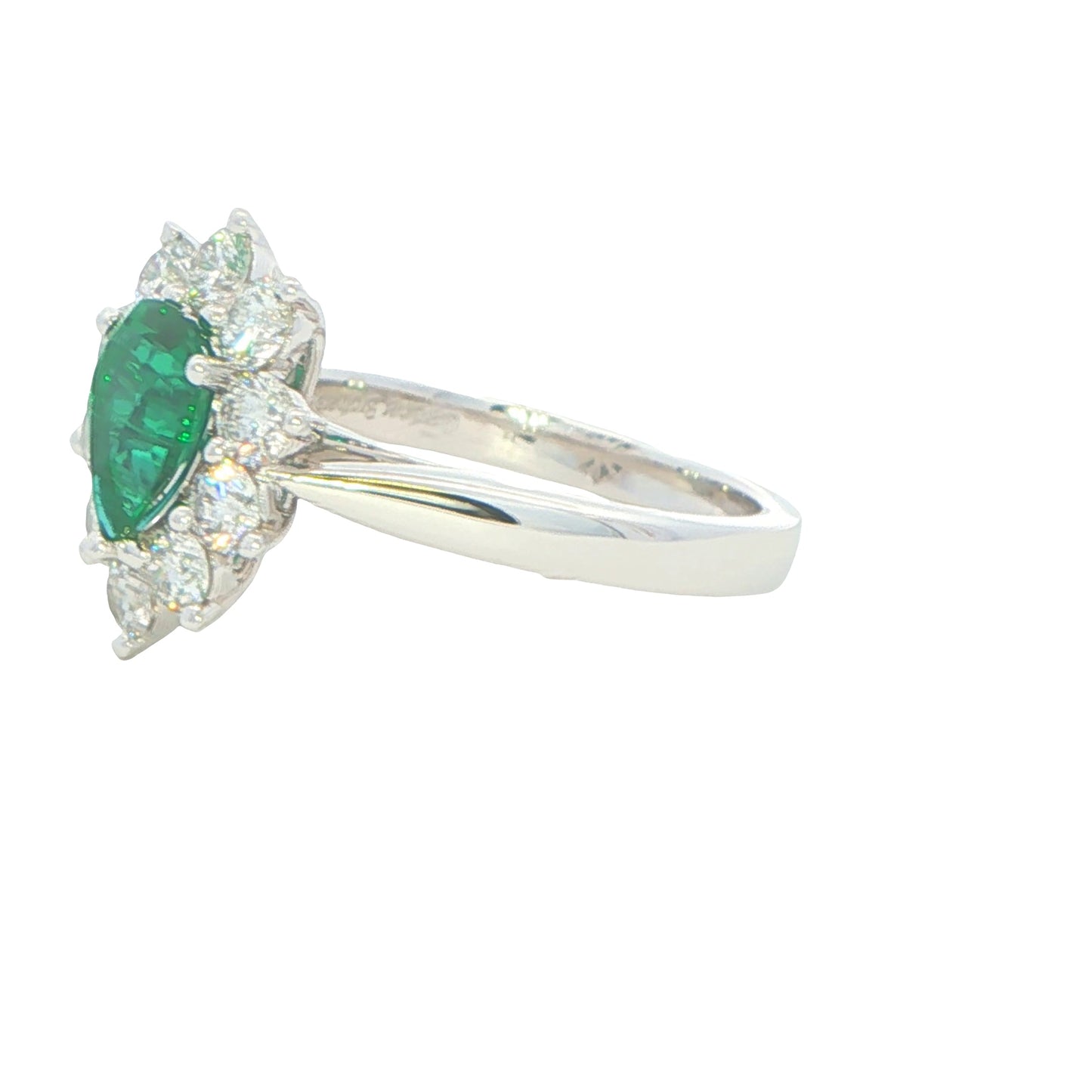 Pear Shaped emerald and round brilliant cut diamond cluster ring