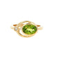 Oval shaped Peridot and round brilliant cut diamond dress ring