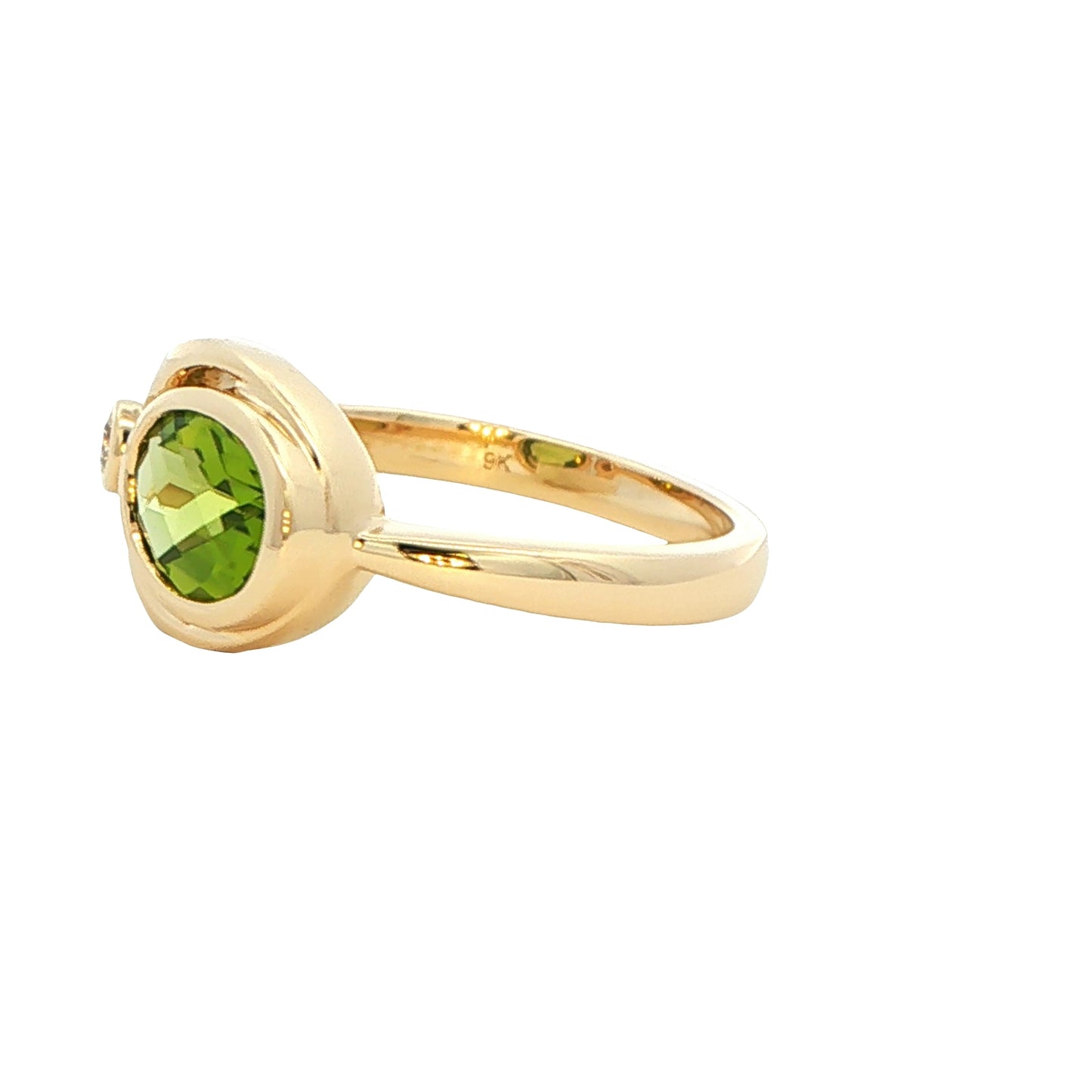 Oval shaped Peridot and round brilliant cut diamond dress ring