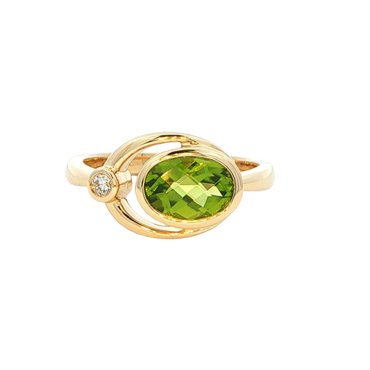Oval shaped Peridot and round brilliant cut diamond dress ring Gardiner Brothers