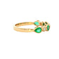Pear shaped emerald and round brilliant cut diamond dress ring