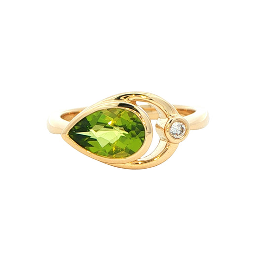 Pear shaped Peridot and round brilliant cut diamond dress ring