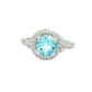 Aquamarine and round brilliant cut diamond halo cluster ring