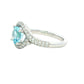 Aquamarine and round brilliant cut diamond halo cluster ring