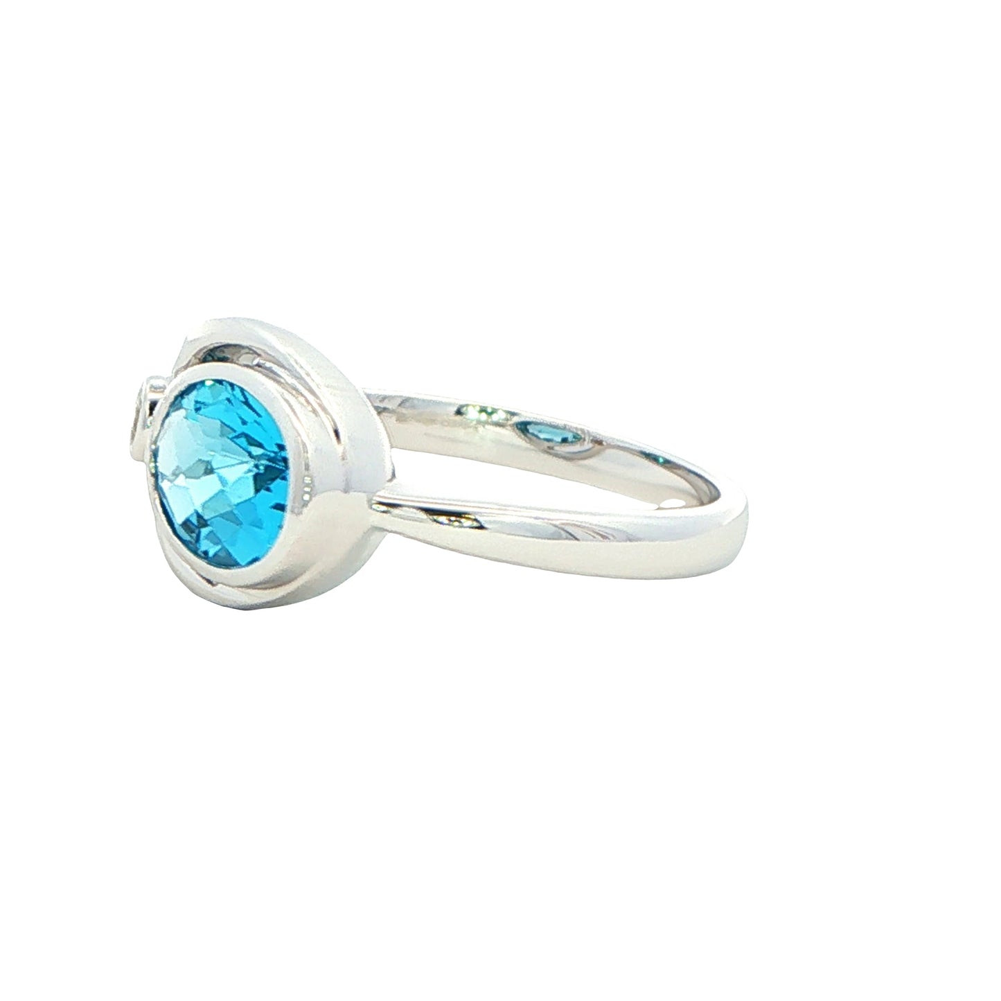 Oval shaped Topaz and round brilliant cut diamond ring