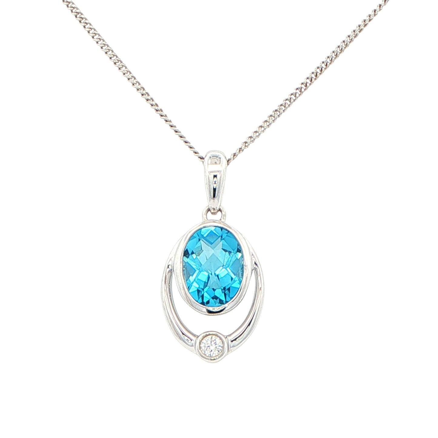 Oval Shaped Topaz and round brilliant cut diamond pendant
