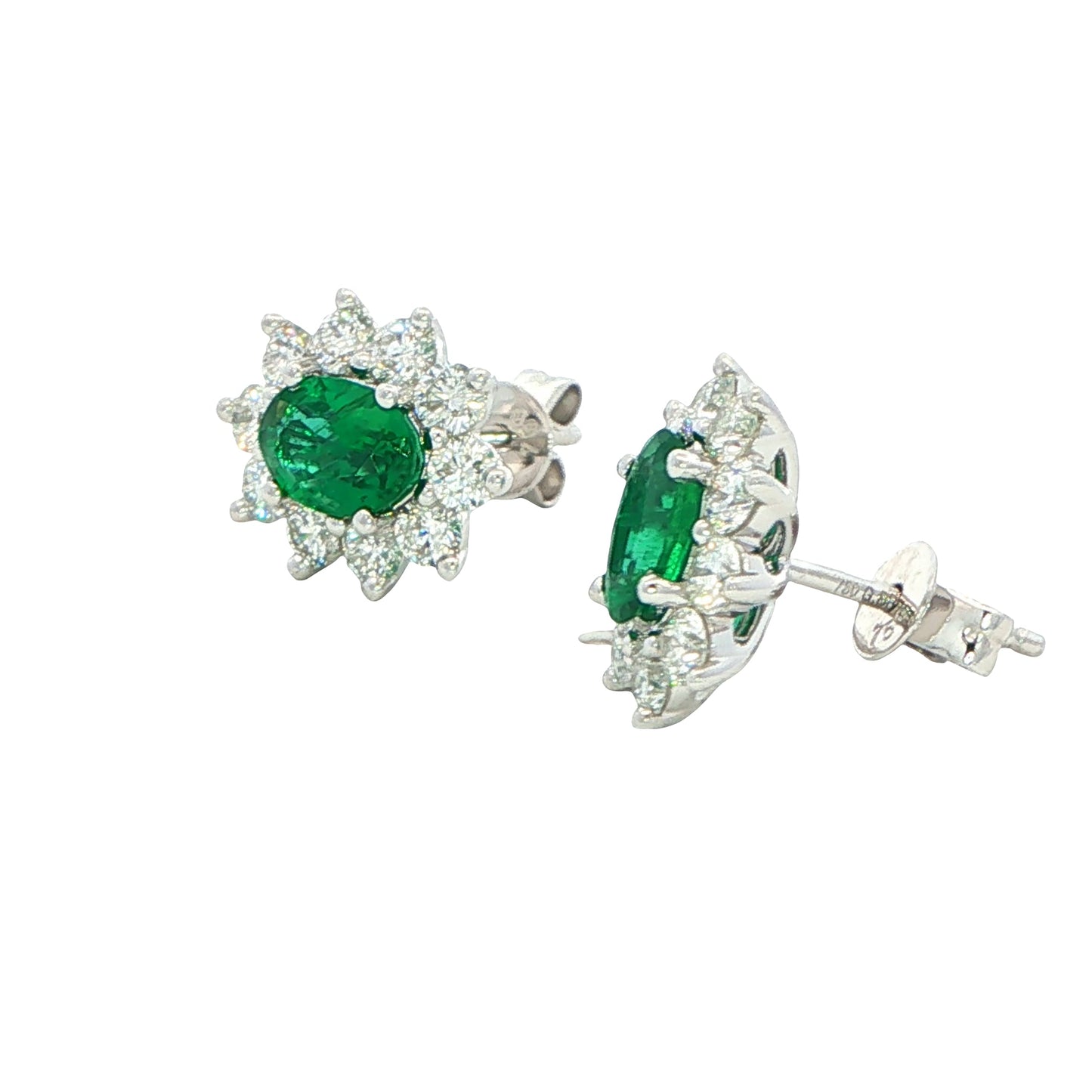 Oval shaped emerald and round brilliant cut diamond cluster style earrings