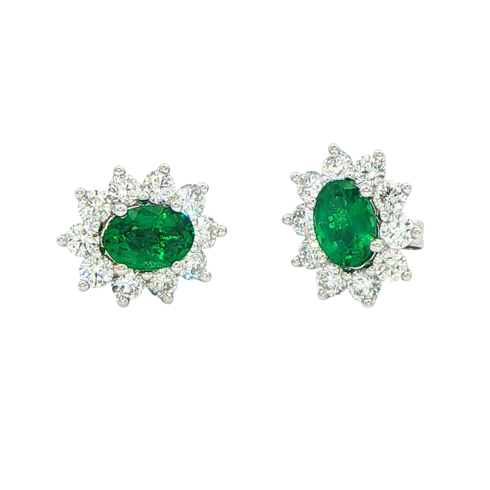 Oval shaped emerald and round brilliant cut diamond cluster style earrings Gardiner Brothers
