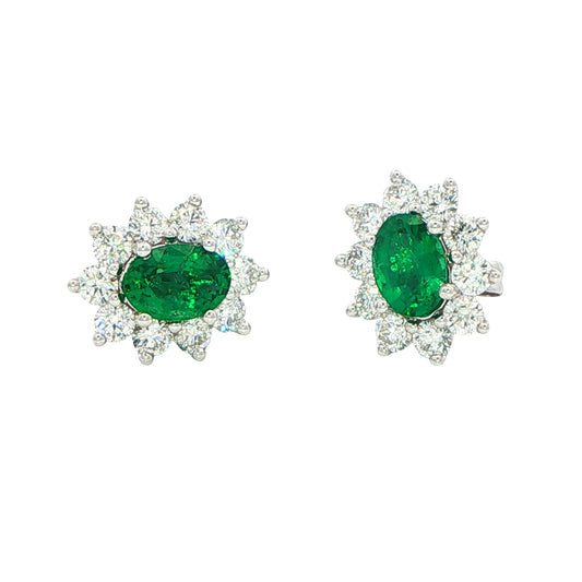 Oval shaped emerald and round brilliant cut diamond cluster style earrings Gardiner Brothers