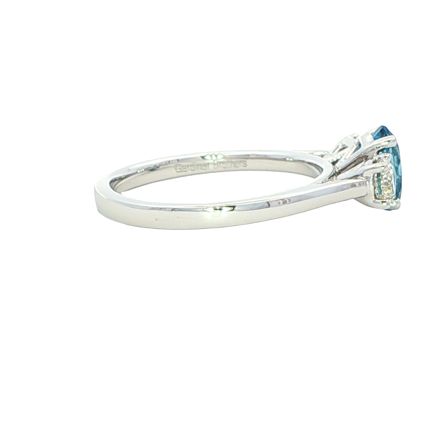 Oval shaped Aquamarine and round brilliant cut diamond 3 stone ring Gardiner Brothers