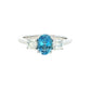 Oval shaped Aquamarine and round brilliant cut diamond 3 stone ring Gardiner Brothers